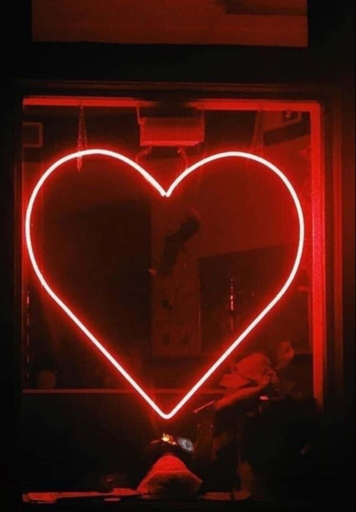 Glowing Neon Red Heart Wallpaper: Love & Warmth on Dark Background