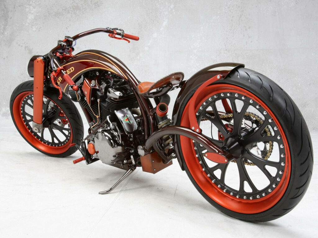 Striking Orange Chopper Motorcycle Wallpaper for Enthusiasts