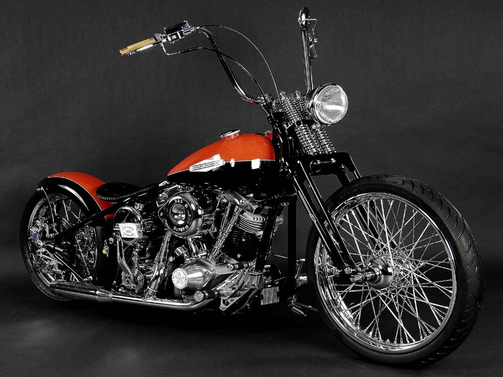 Custom orange Harley Davidson chopper with chrome engine ape hanger handlebars HD wallpaper background