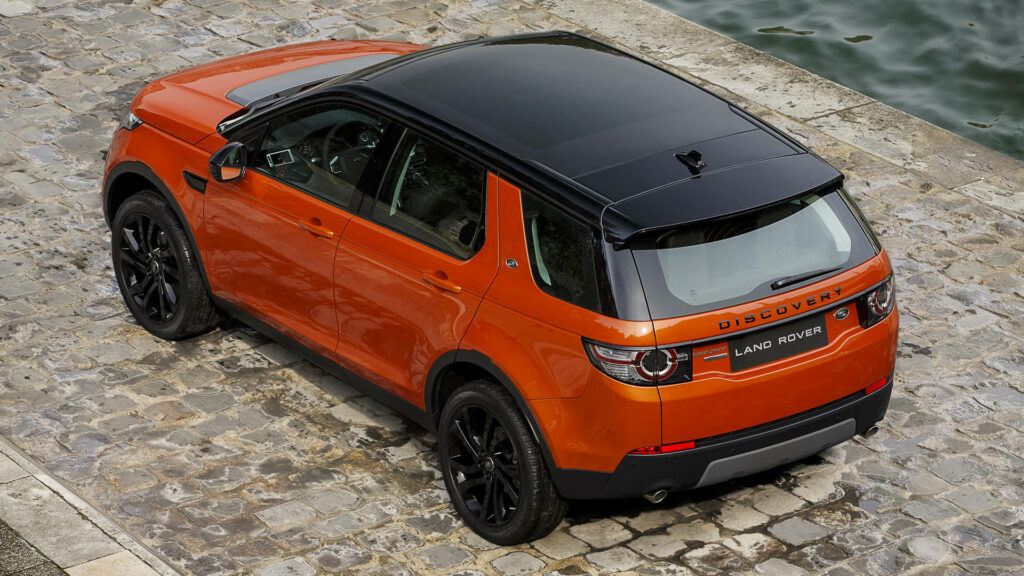 Stunning Orange Land Rover Discovery: Car Wallpaper Background