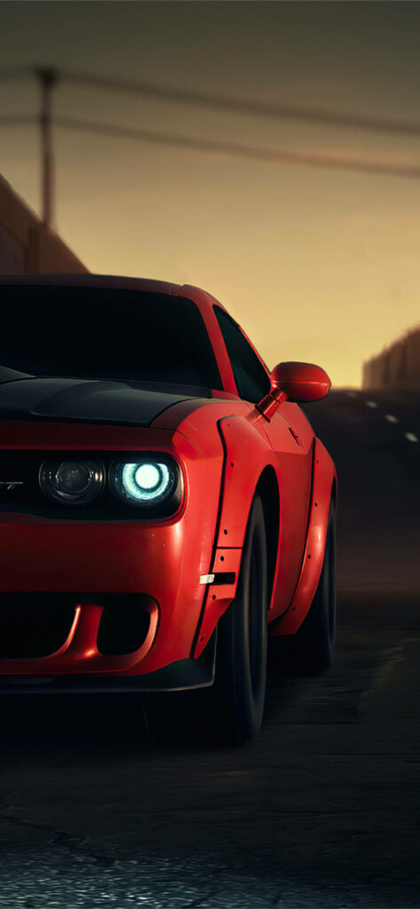 Red sports car driving at sunset on dim road dynamic wallpaper background capturing thrill