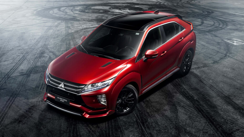 Sleek Red Mitsubishi Eclipse Wallpaper: Sporty Design & Motion