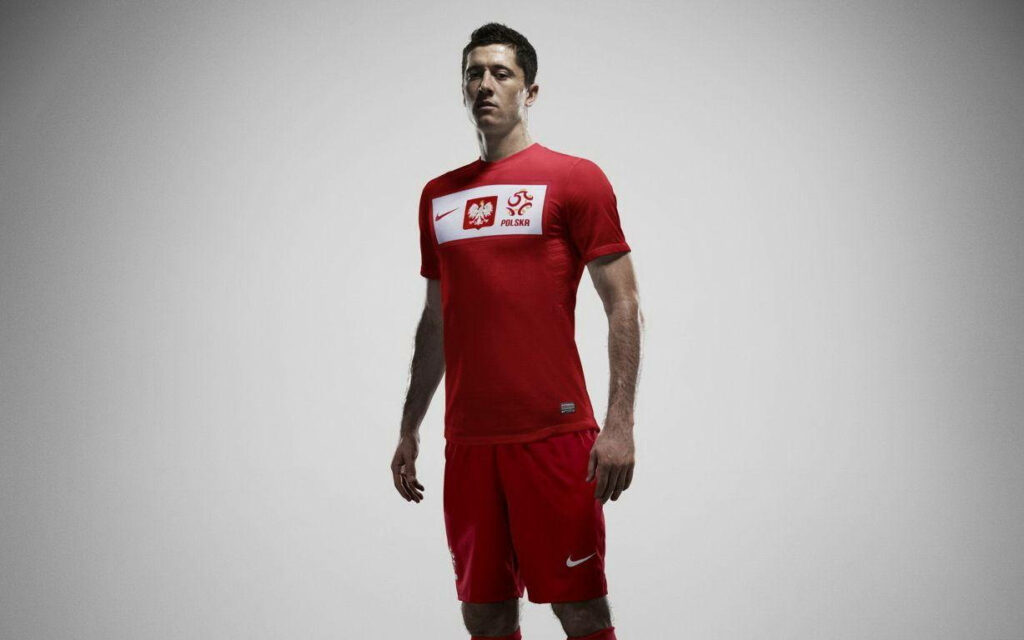 Bold Robert Lewandowski Portrait Wallpaper - Red Jersey Background