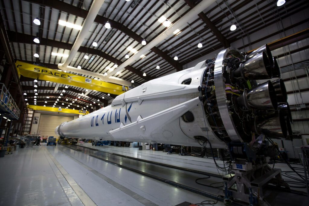 SpaceX Rocket in Hangar: Intricate Engineering Wallpaper Background