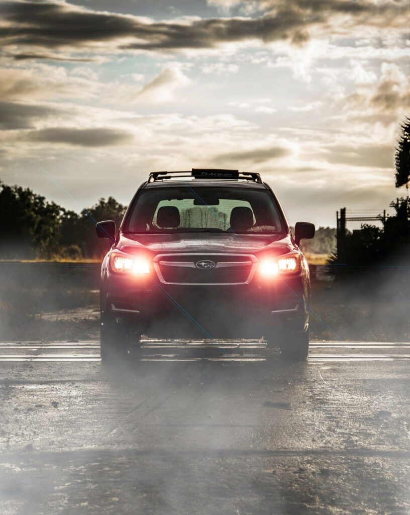 Black Subaru SUV Wallpaper: Dramatic Smoke & Mood Lighting