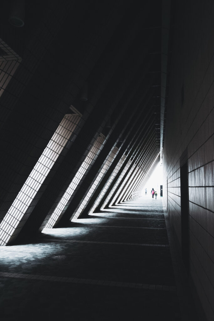 Striking Triangular Tunnel Wallpaper with Dramatic Lines and Depth