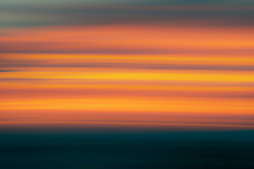 Vibrant Layers: A Mesmerizing Sunset in Stripes and Gradient Wallpaper