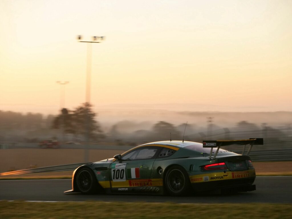 2005 Aston Martin DBR9 Wallpaper: Sleek Racing Car in Nature