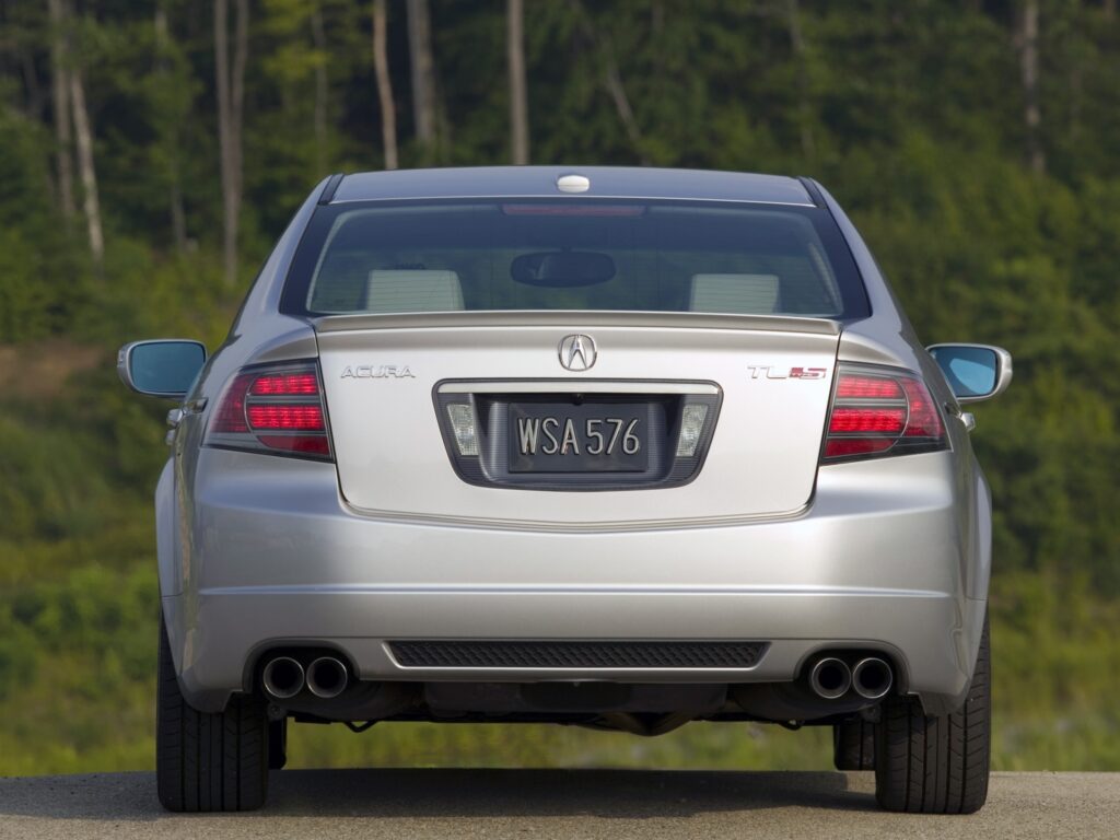Elegant 2007 Metallic Silver Acura TL - Rear View in Lush Background Wallpaper