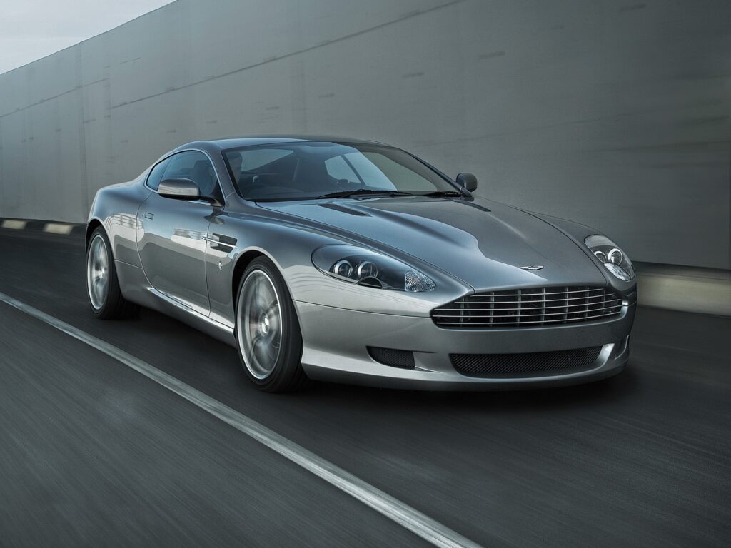 2008 Aston Martin DB9: Sleek White Elegance on Asphalt Road Wallpaper