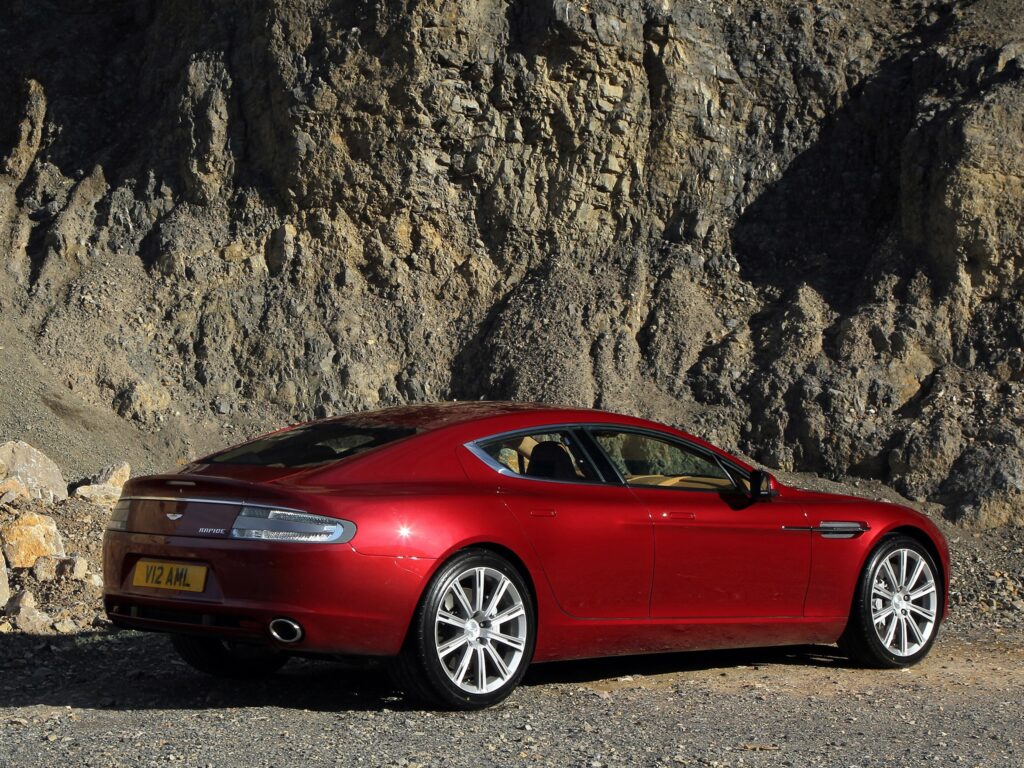 2009 Aston Martin Rapide Side View | Stunning Rock Background Wallpaper