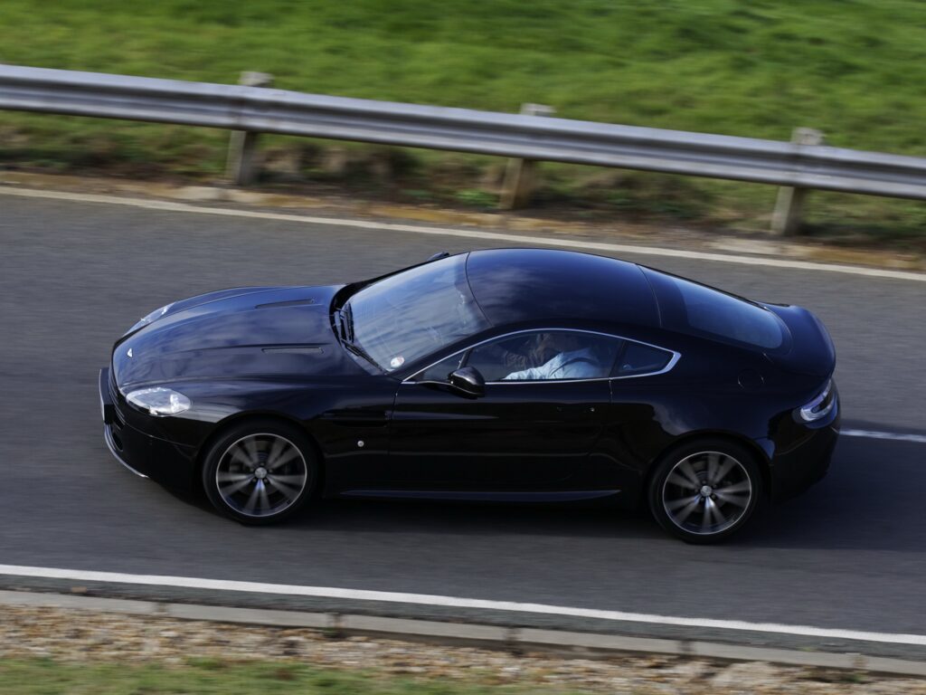 Sleek 2010 Aston Martin V8 Vantage Black Side View Wallpaper