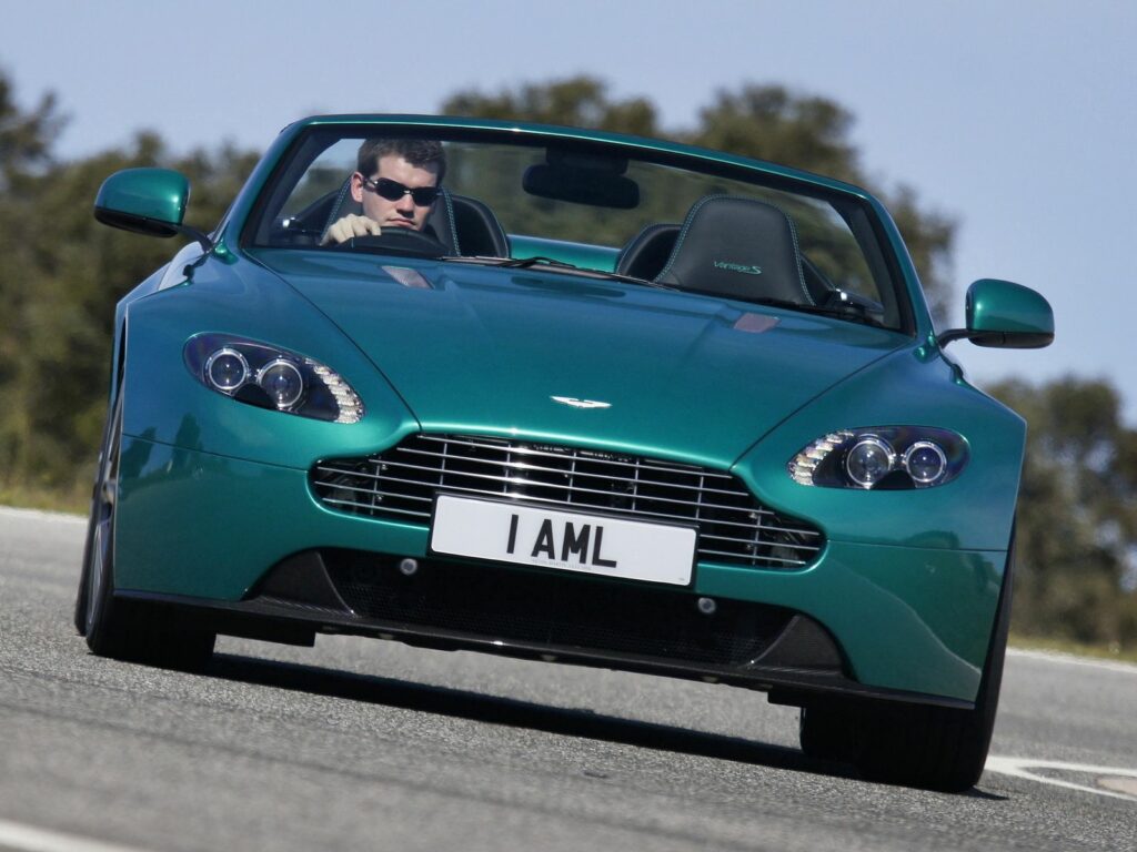 Stunning Green 2011 Aston Martin V8 Vantage Wallpaper on Asphalt