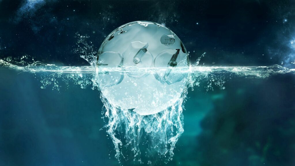 Stunning 2560x1440 Wallpaper: Crystal Ball Splash on Dark Background