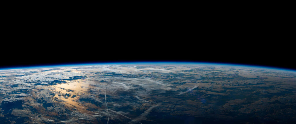 Stunning 3440x1440 Space Wallpaper: Earth's Surface & Clouds