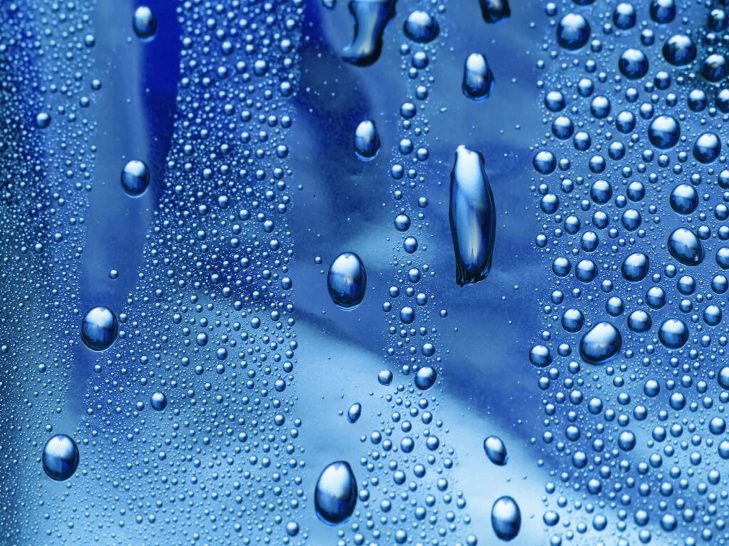 Stunning 3D Water Droplets Wallpaper on Metallic Blue Background