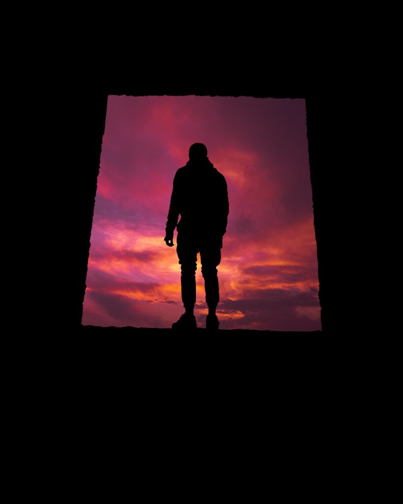 Vibrant Sunset Wallpaper: Solitary Figure Silhouette Background