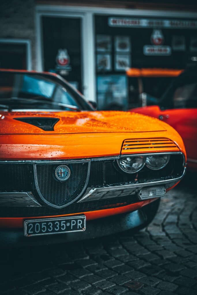 Vibrant 4480x6720 Alfa Romeo Wallpaper with Water Droplets