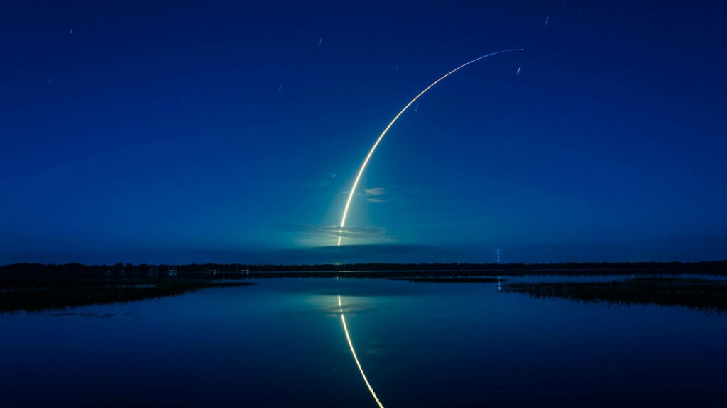 Stunning Falcon 9 Launch 4K Wallpaper: Night Sky & Water Reflection