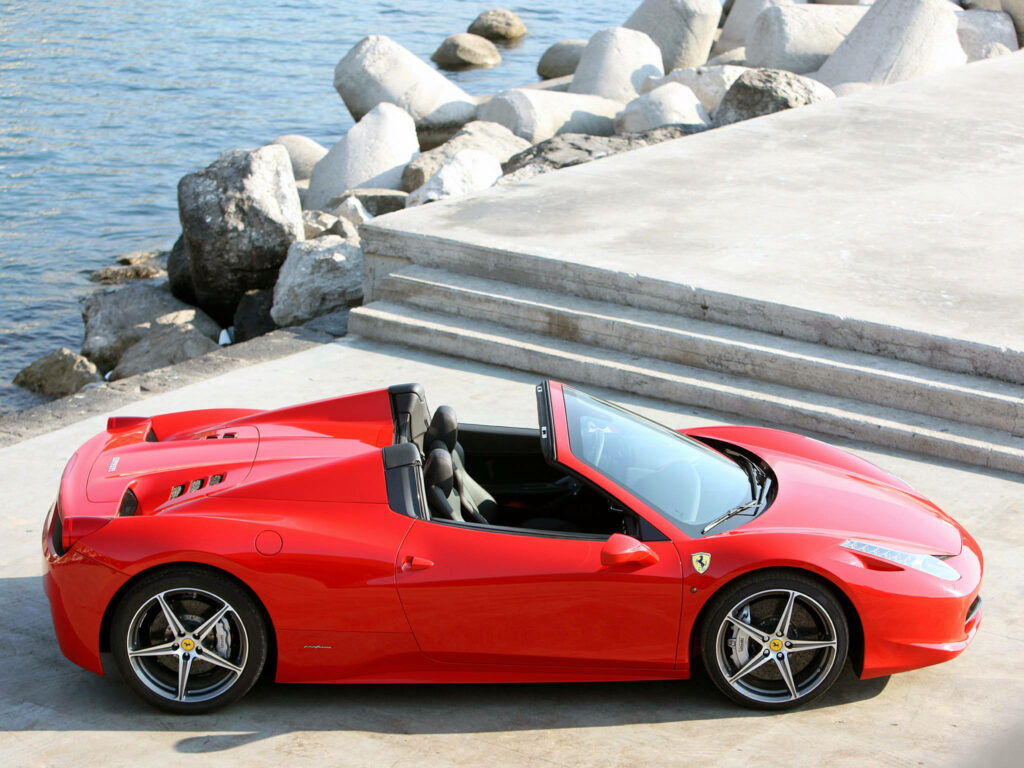 Exquisite 4K Ferrari 2013 Spider Car Model: Captivating Red Beauty Parked Alongside Scenic Bay Wallpaper