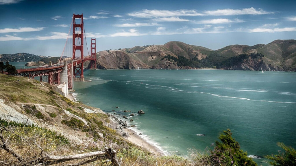 Stunning 4K Golden Gate Bridge Wallpaper with Hills & Blue Sky