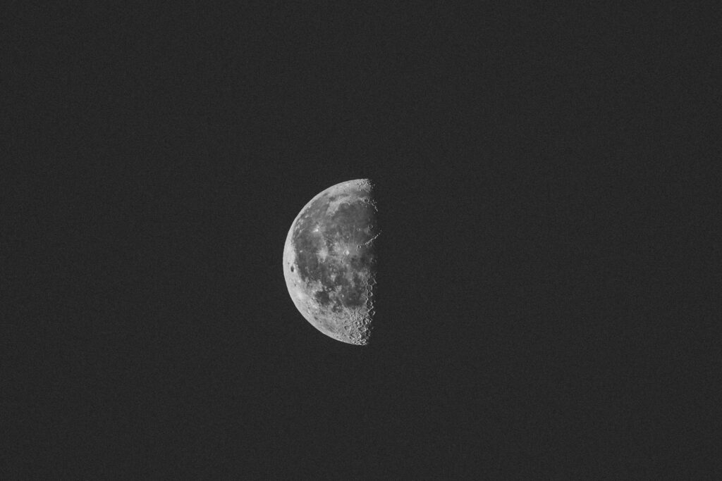 Stunning 4K Half-Moon Wallpaper: Detailed Craters on Dark Background