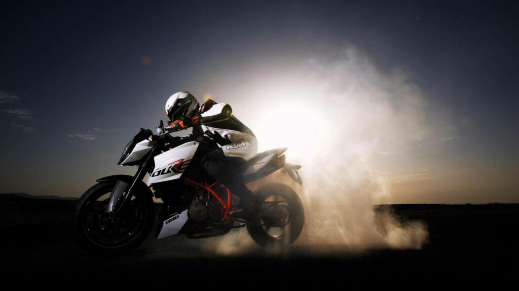 4K KTM Bike Rider at Sunrise: Dynamic Action Wallpaper Background