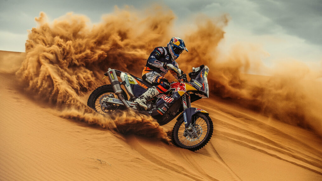 Stunning 4K KTM Motorcycle Wallpaper: Rider Sliding in Desert Dunes