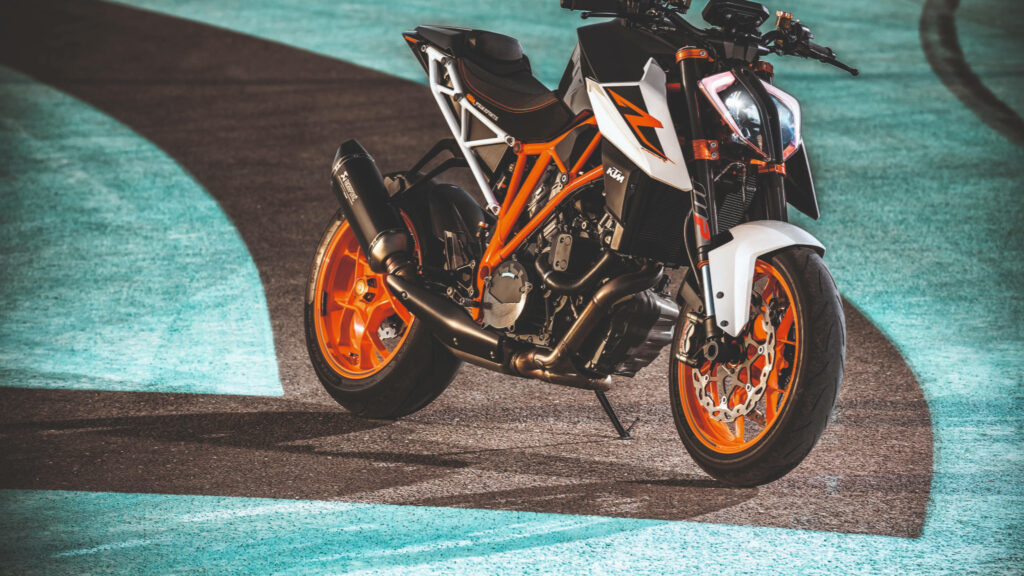 Vibrant 4K KTM Motorcycle Wallpaper: Black & Orange Urban Design