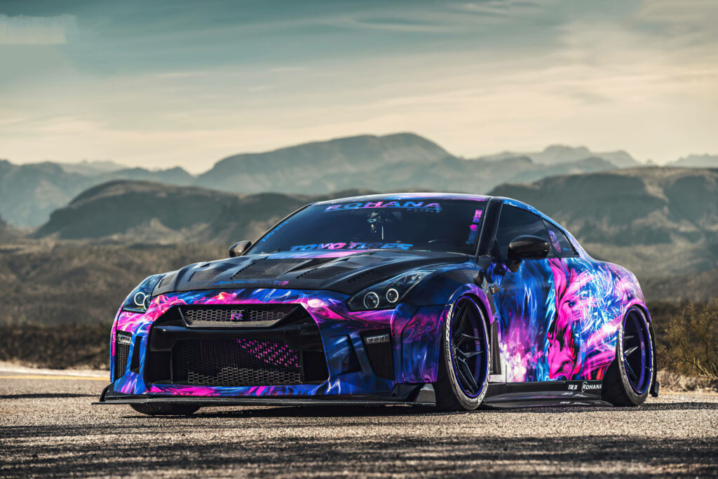 Vibrant 4K Nissan GT-R Wallpaper: Neon Custom Wrap in Desert Scene