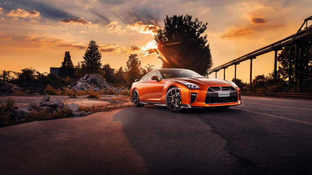 Stunning 4K Wallpaper: Orange Nissan GT-R at Sunset Backdrop