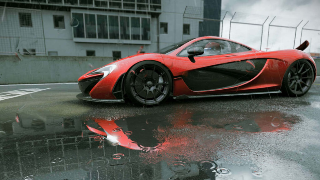 Red McLaren P1 on wet racetrack with rain reflections high performance supercar wallpaper