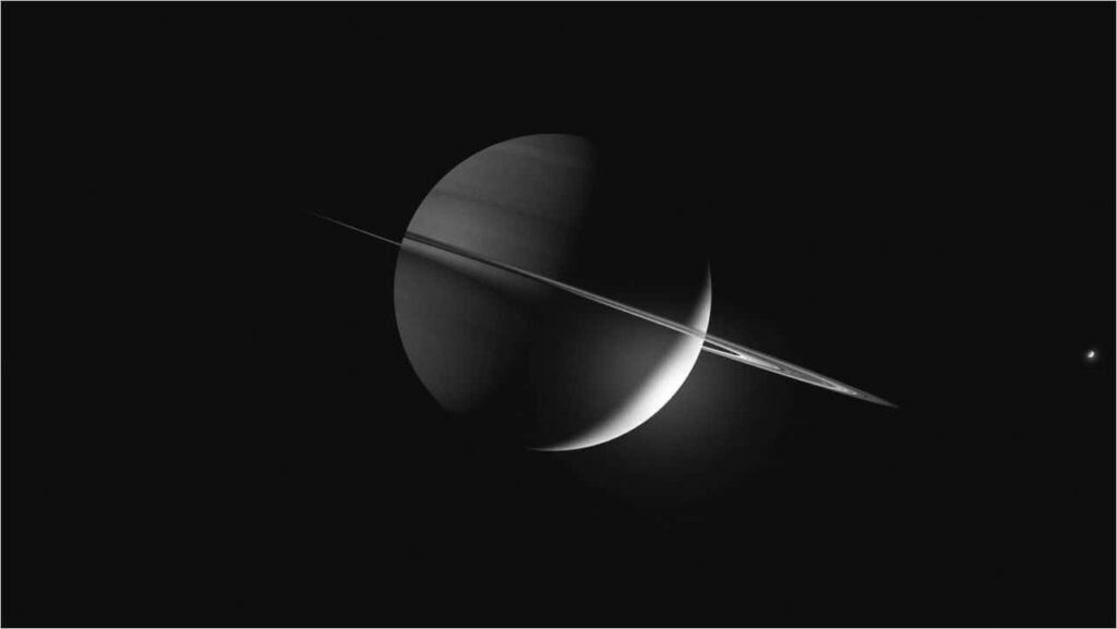 Stunning 4K Saturn with iconic rings illuminated in deep space backdrop wallpaper.