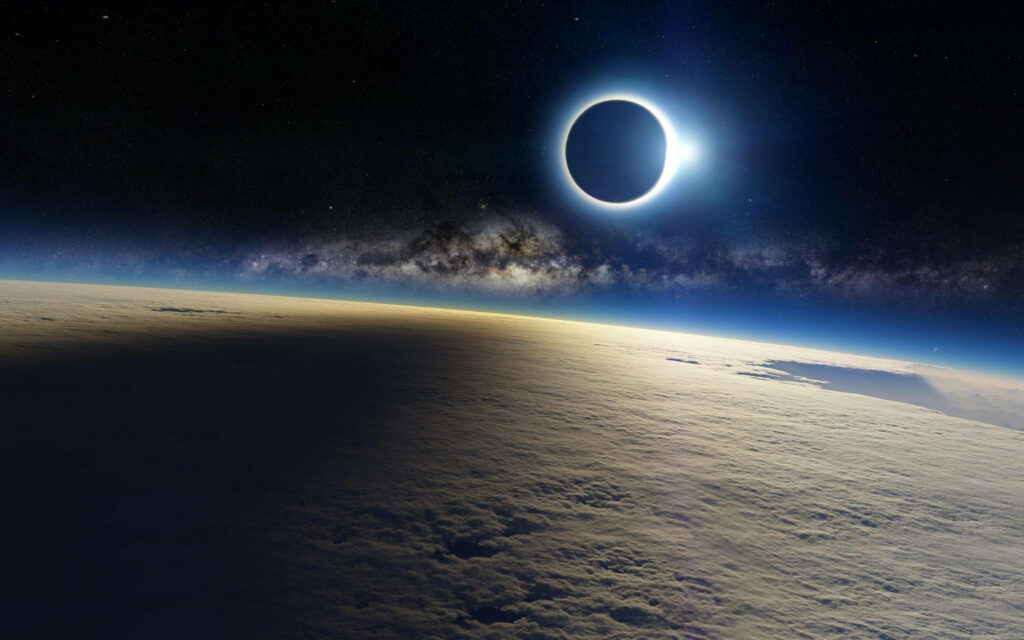 Stunning 4K wallpaper of solar eclipse from space, showcasing Earth's shadow and vibrant galaxy.