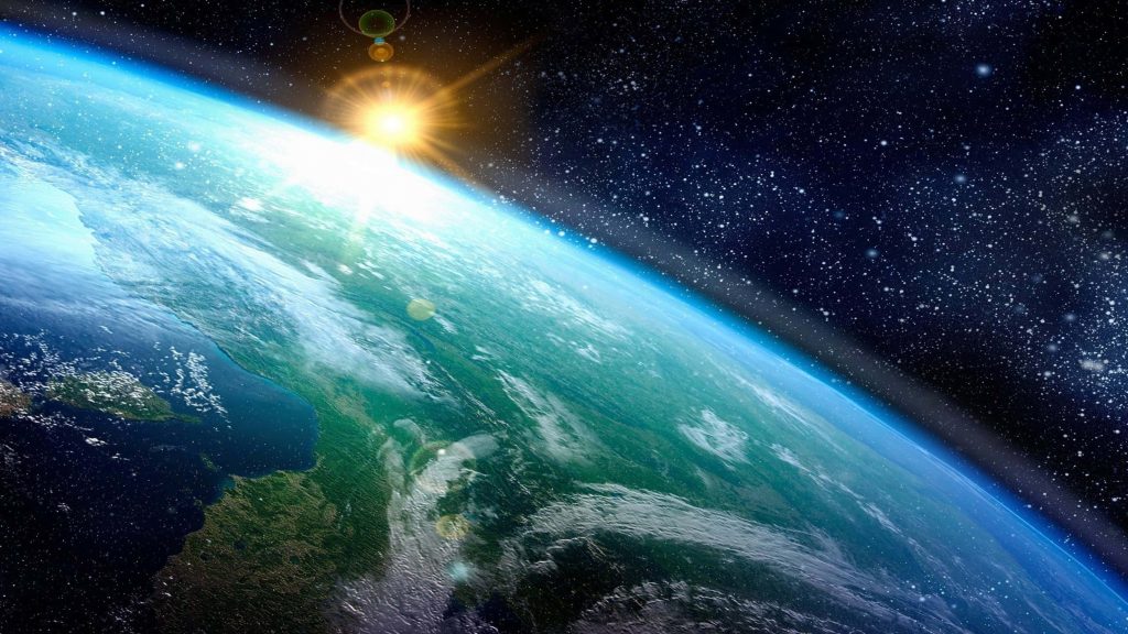 4K Ultra HD Earth sunrise digital art with vibrant land oceans lens flare starry space background Wallpaper