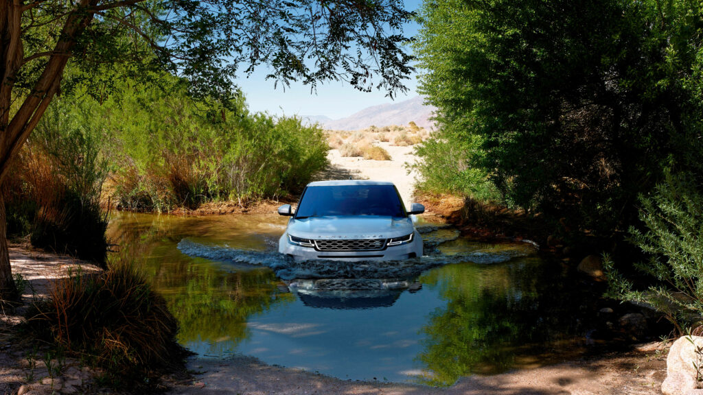 4K Range Rover in Serene Forest Stream - Stunning Wallpaper Background