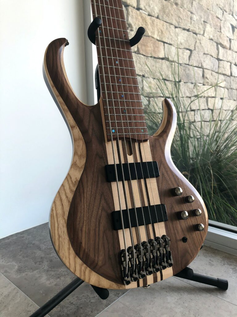 Stunning 7-String Electric Guitar Wallpaper with Natural Wood Finish