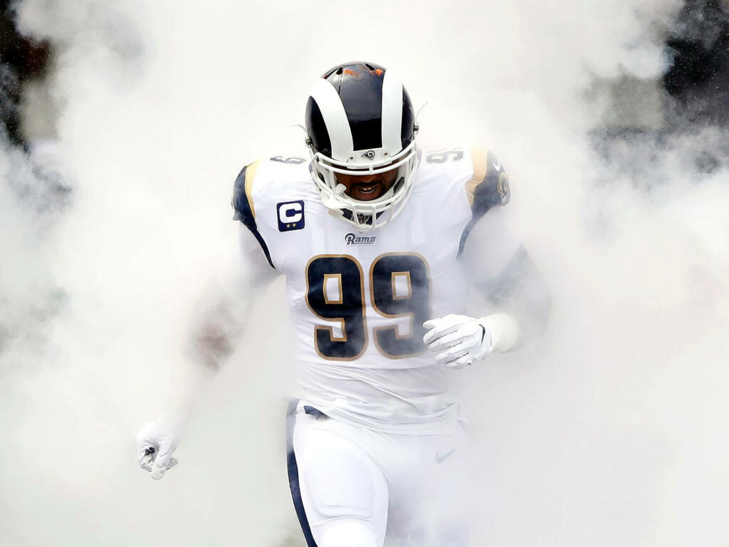 Dynamic Wallpaper of Aaron Donald in Smoke – Rams Star on Field