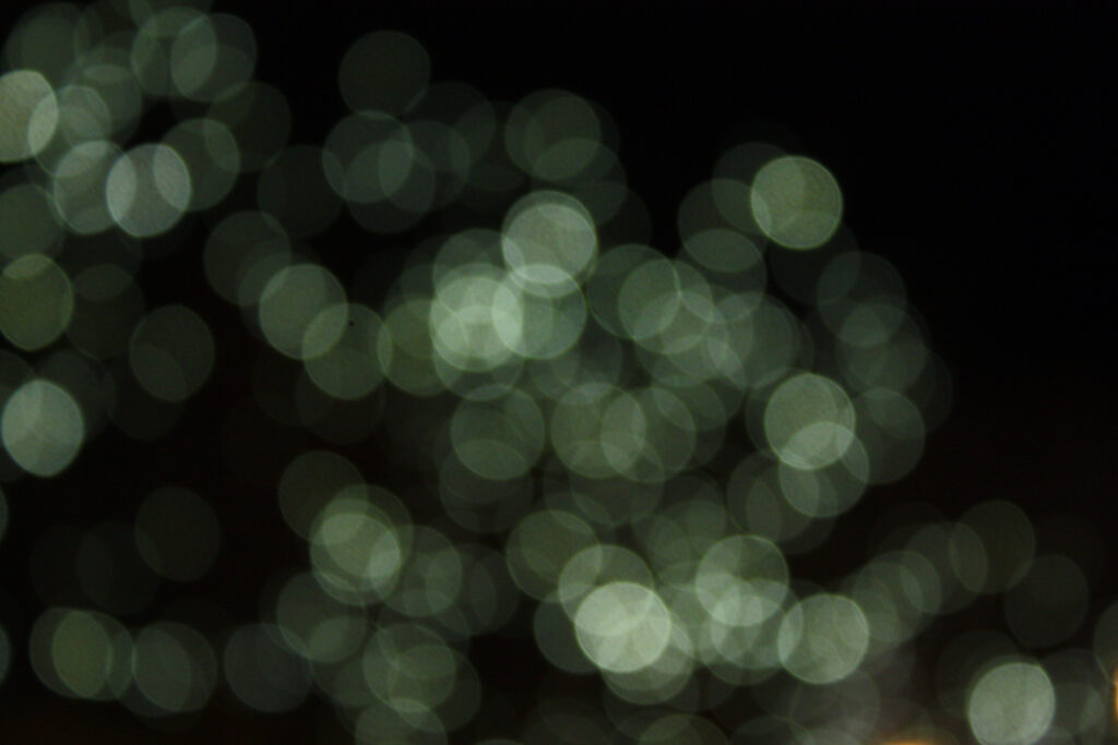 Stunning Abstract Bokeh Wallpaper: Ethereal Green Circles on Dark