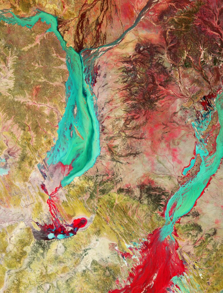 Vibrant High-Res Abstract Wallpaper: Aerial River Over Rugged Landscape
