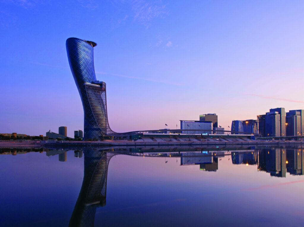 Stunning Capital Gate Wallpaper: Vibrant Sunset Reflection in Abu Dhabi