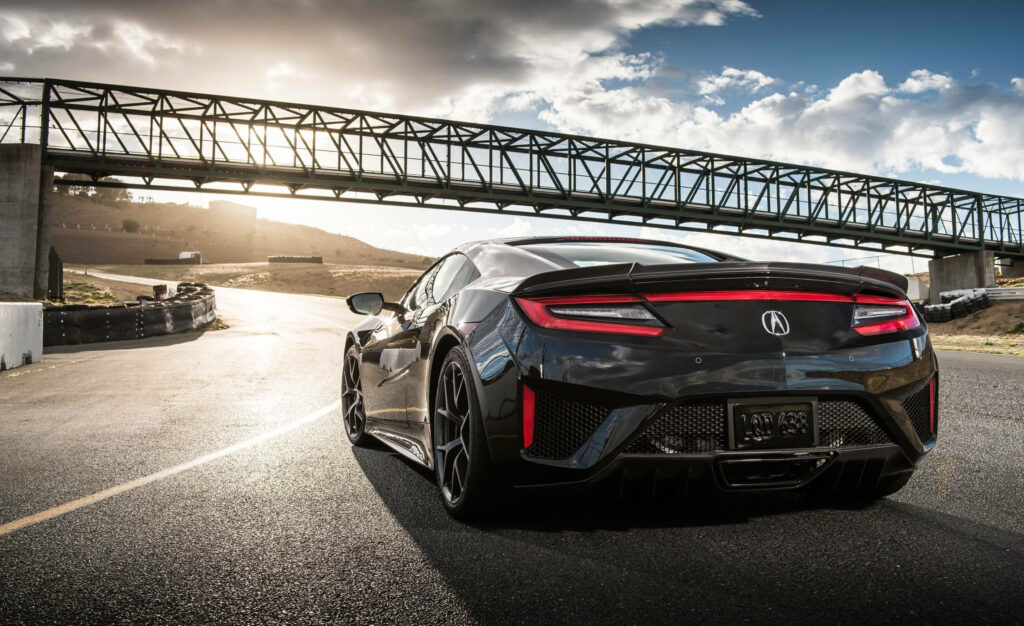 Stunning Wallpaper: Sleek Black Acura Car on Scenic Road