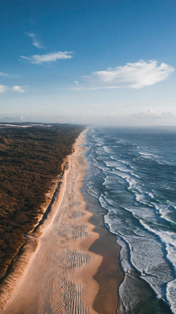 Stunning Aerial Beach Wallpaper: Ocean Meets Shoreline