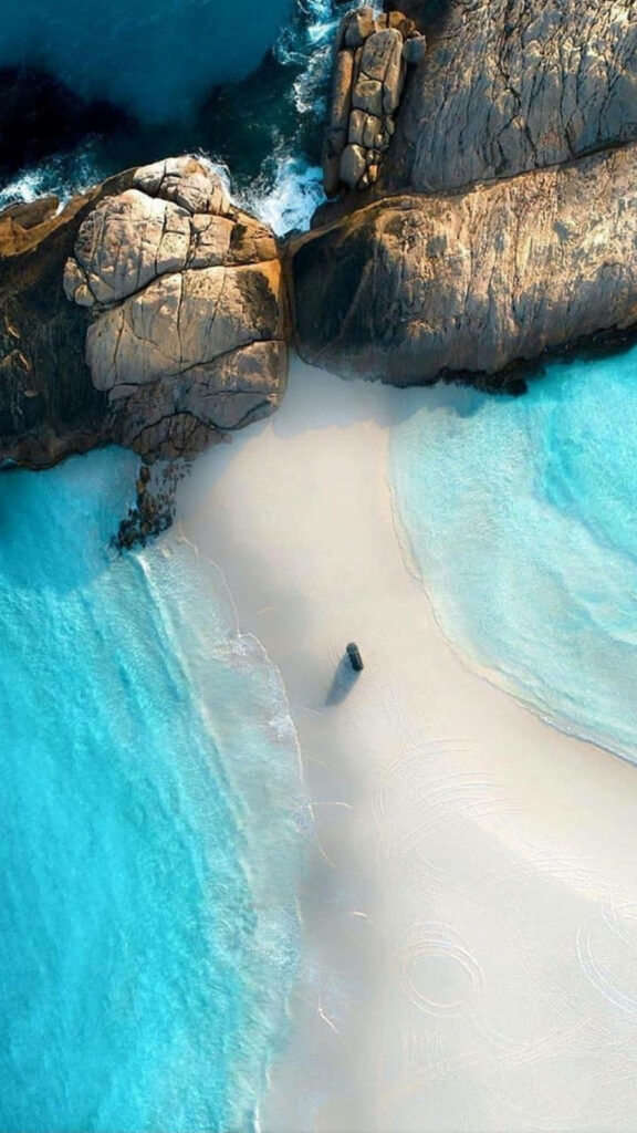 Stunning Aerial Beach Wallpaper: Turquoise Waters & Rocky Coastline