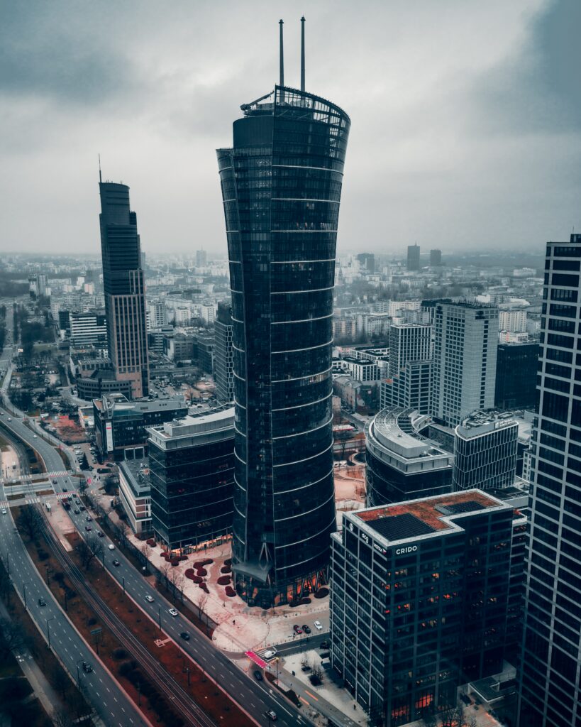 Stunning Aerial Cityscape Wallpaper: Curved Skyscraper & Urban Design