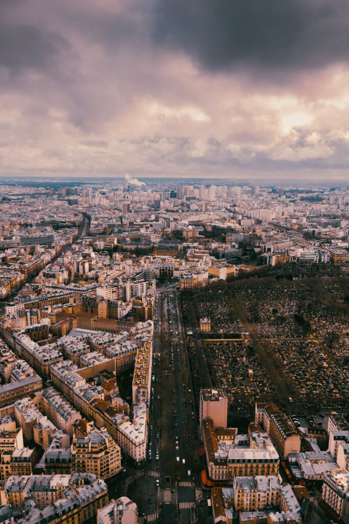 Stunning Aerial Cityscape Wallpaper: Metropolis Under Dramatic Sky