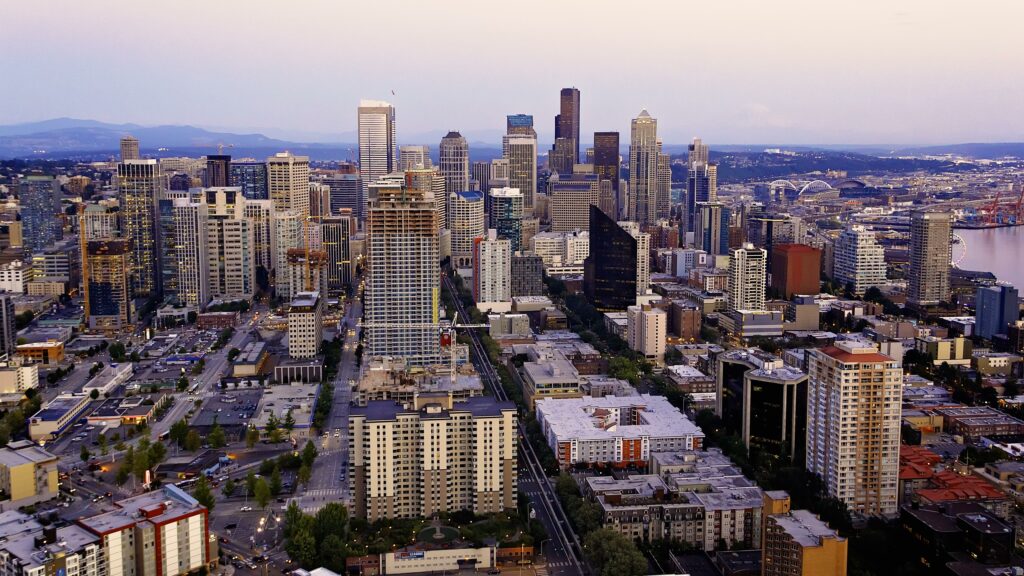 Stunning Aerial Cityscape Wallpaper: Modern Architecture & Nature