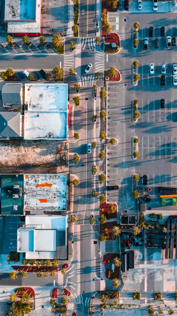 Vibrant Cityscape Wallpaper: Aerial View with Buildings & Palm Trees