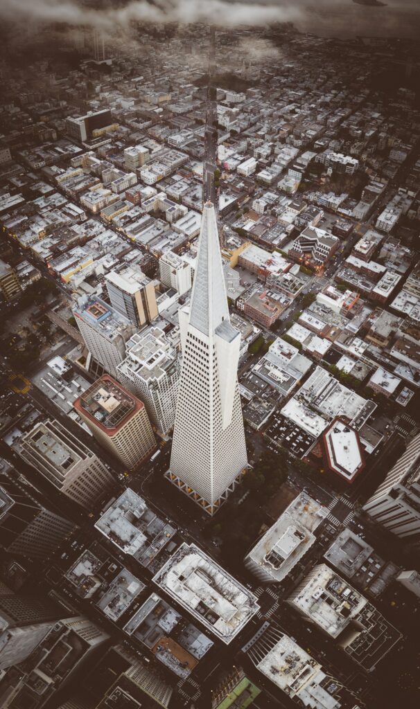 Aerial Cityscape Wallpaper: Stunning Skyscraper with Pyramid Design