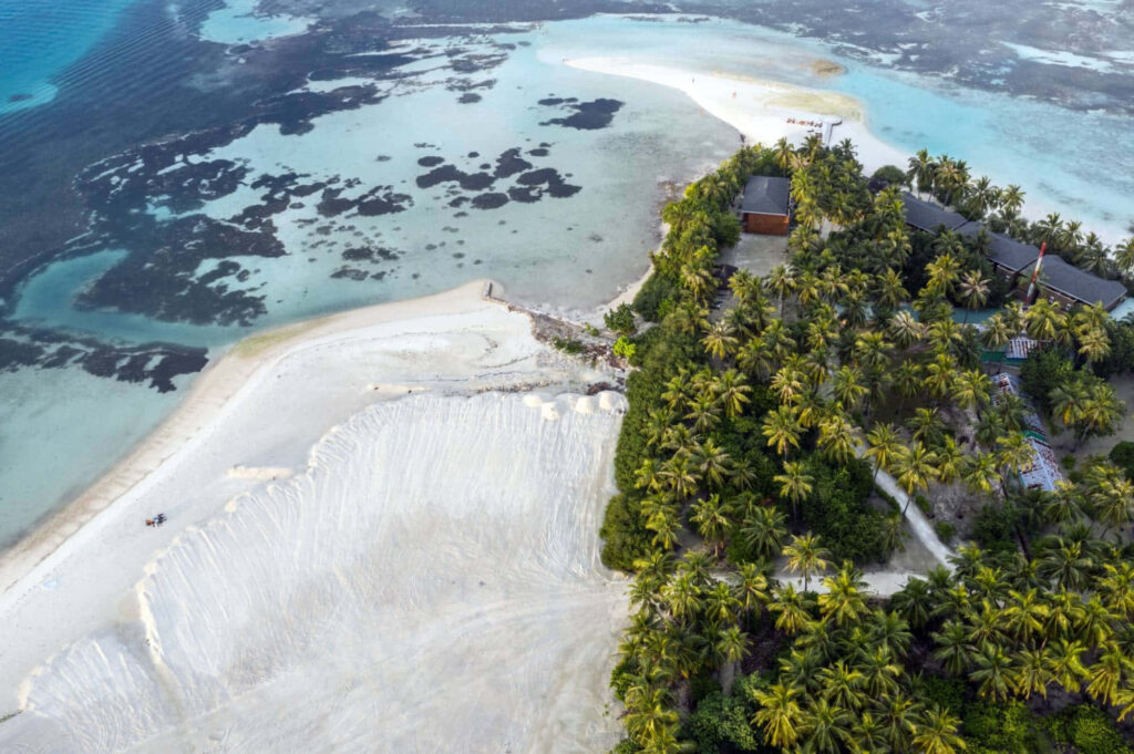 Stunning Aerial View of Tropical Island: Turquoise Waters & Beaches Wallpaper